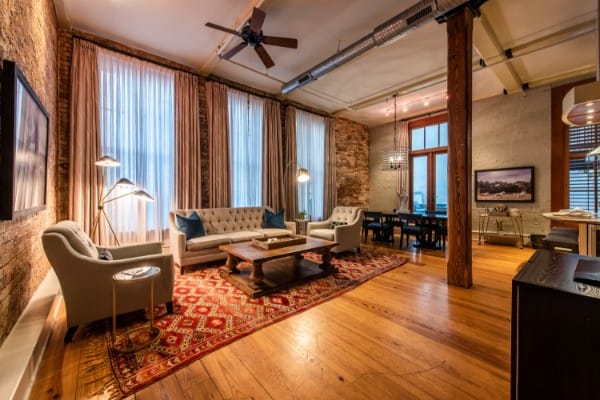 Chic Grand 2 bedroom residence in The Restoration Hotel Charleston with stylish loft design and open kitchen.