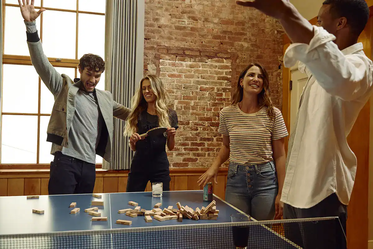 Friendly group enjoying games at The Restoration Hotel.